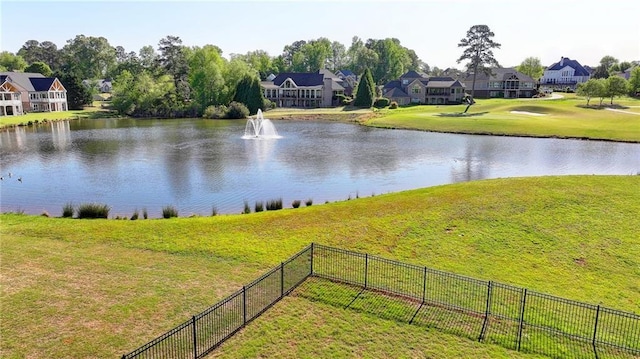 property view of water with fence and a residential view