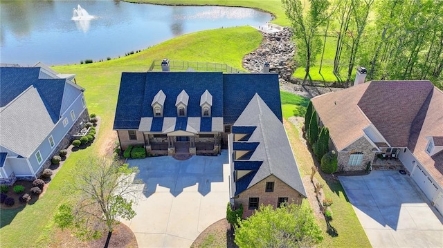 birds eye view of property with a water view