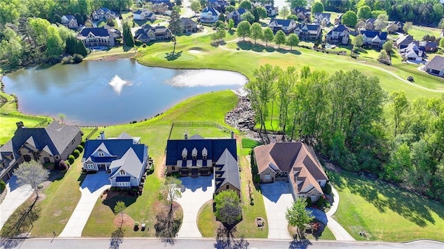 drone / aerial view with a water view and a residential view