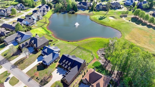 birds eye view of property with a residential view, a water view, and golf course view