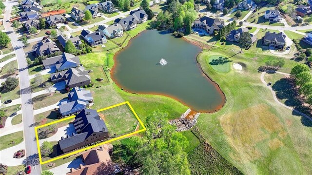 birds eye view of property with a residential view, view of golf course, and a water view