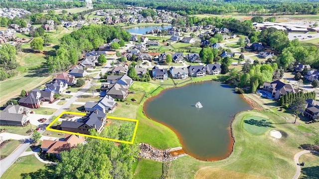 birds eye view of property with a water view, view of golf course, and a residential view