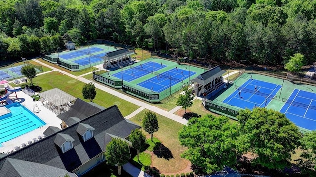 drone / aerial view featuring a wooded view