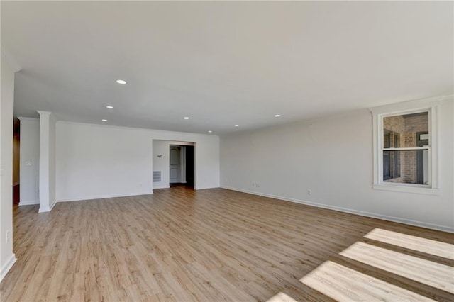 interior space with recessed lighting, baseboards, and light wood-style floors