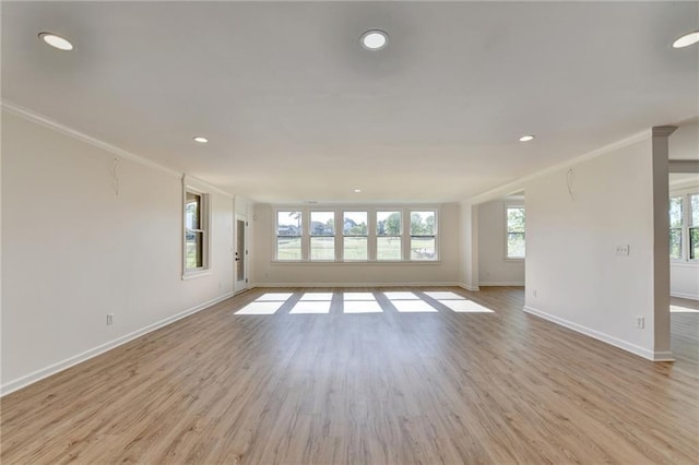 unfurnished living room with recessed lighting, baseboards, ornamental molding, and light wood-style floors