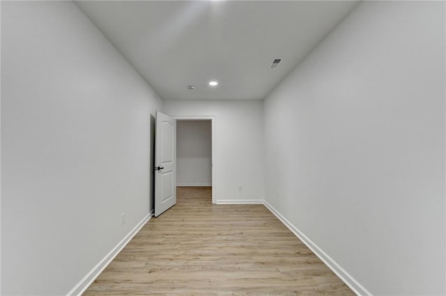 hall with recessed lighting, baseboards, visible vents, and light wood-type flooring