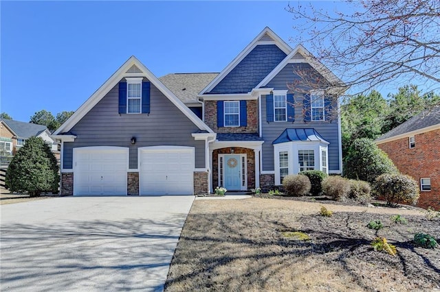 craftsman-style home featuring stone siding and concrete driveway