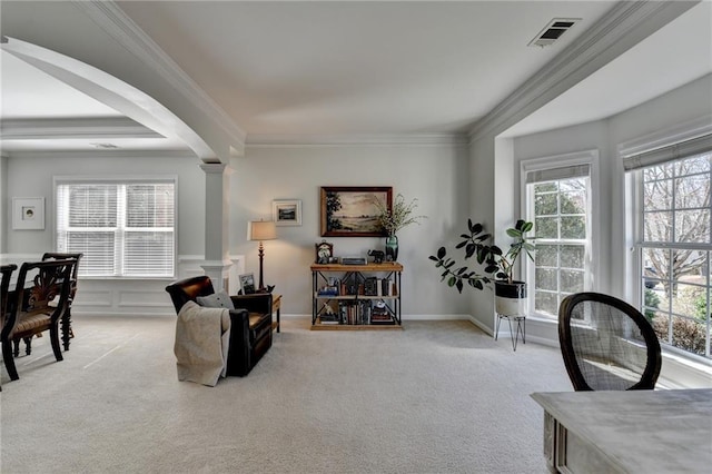 living area featuring light carpet, visible vents, and crown molding