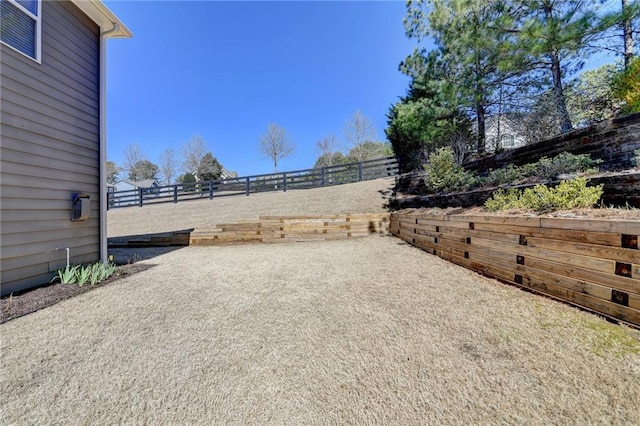 view of yard featuring a patio and fence