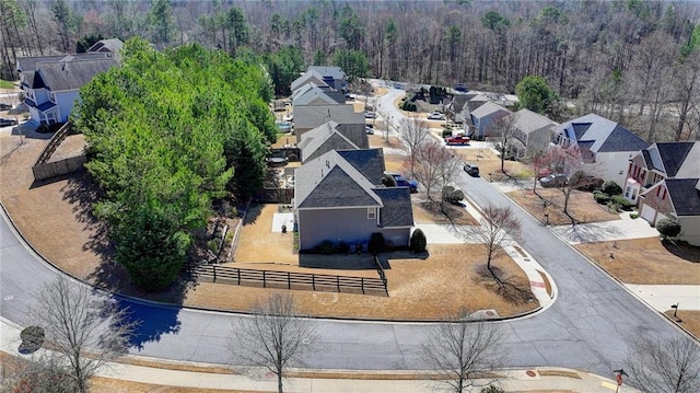 aerial view featuring a residential view and a wooded view