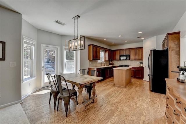 dining space with a wealth of natural light, visible vents, baseboards, and recessed lighting