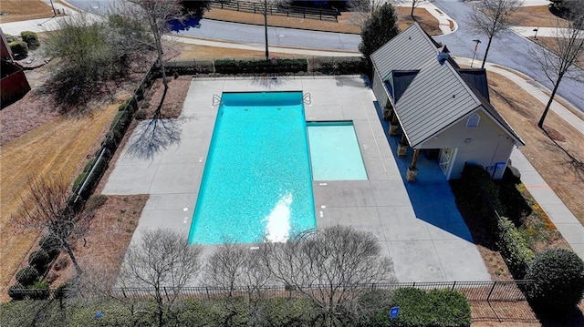 pool featuring a patio area and fence