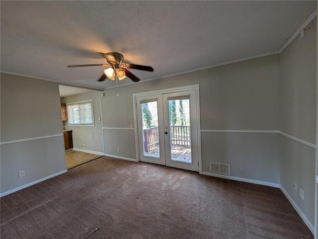 unfurnished room with visible vents, french doors, carpet, baseboards, and ceiling fan