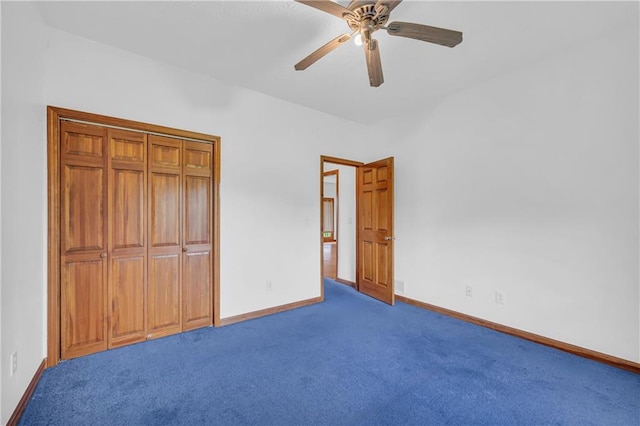 unfurnished bedroom featuring baseboards, carpet, and ceiling fan