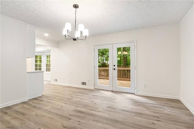 3021 Mills Ridge Dr, Canton, GA 30114 - empty room with plenty of natural light, a chandelier, a textured ceiling, crown molding, and light wood finished floors