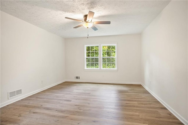 3021 Mills Ridge Dr, Canton, GA 30114 - spare room with a ceiling fan, a textured ceiling, wood finished floors, and baseboards