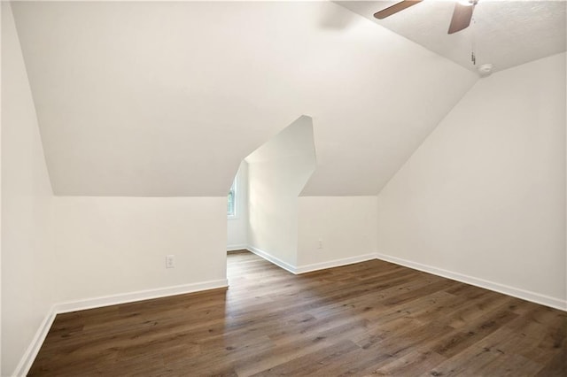 3021 Mills Ridge Dr, Canton, GA 30114 - bonus room featuring vaulted ceiling, dark wood-type flooring, ceiling fan, and baseboards
