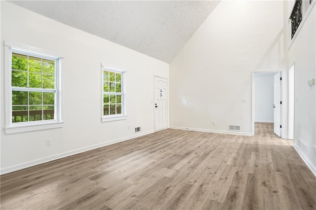 3021 Mills Ridge Dr, Canton, GA 30114 - unfurnished room featuring high vaulted ceiling, light wood-style floors, and baseboards