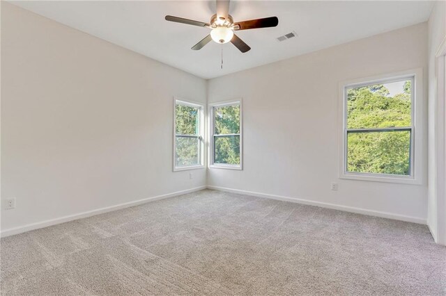 70 Wheeler Lake Path, Dallas, GA 30157 - spare room with healthy amount of natural light, carpet flooring, baseboards, and a ceiling fan