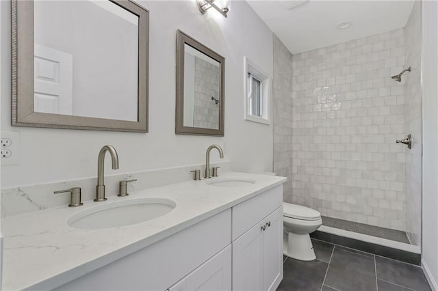 70 Wheeler Lake Path, Dallas, GA 30157 - full bath featuring toilet, double vanity, tile patterned floors, and a tile shower