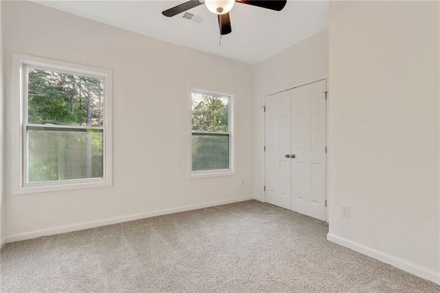 70 Wheeler Lake Path, Dallas, GA 30157 - unfurnished bedroom with carpet, baseboards, a closet, and a ceiling fan
