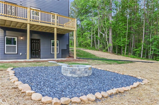 70 Wheeler Lake Path, Dallas, GA 30157 - view of yard featuring a fire pit and a wooden deck