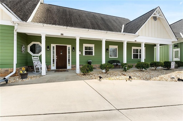 150 Crestview Rd, Jackson, GA 30233 - view of front facade featuring covered porch, board and batten siding, and a shingled roof