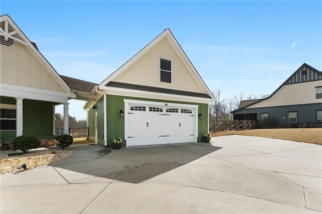 150 Crestview Rd, Jackson, GA 30233 - view of side of property with board and batten siding, a garage, concrete driveway, and fence