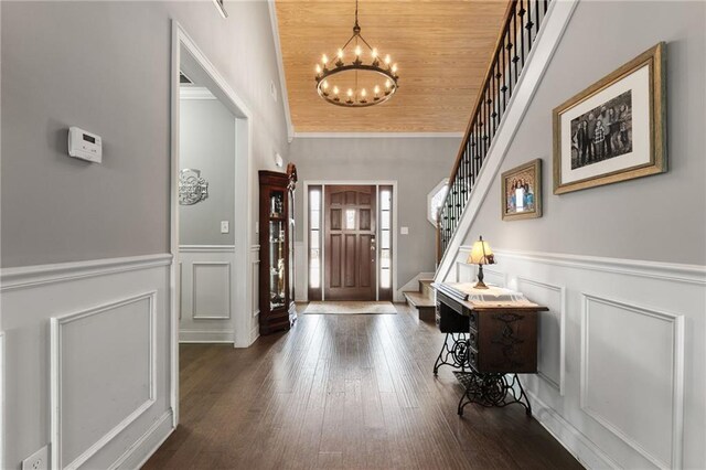 150 Crestview Rd, Jackson, GA 30233 - entryway featuring a decorative wall, a chandelier, stairs, wainscoting, and dark wood-style flooring