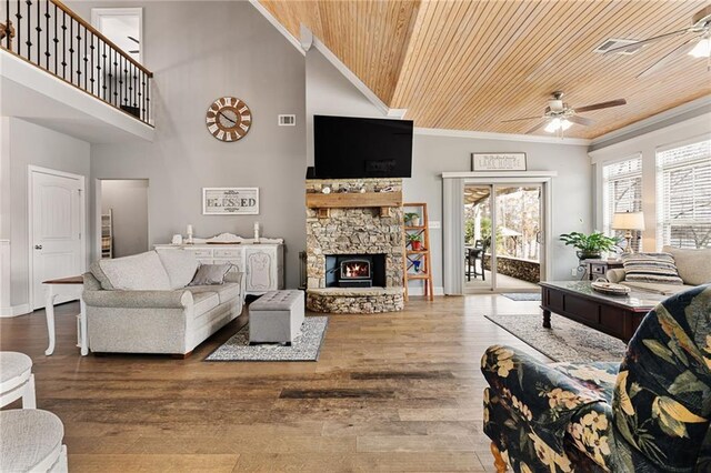 150 Crestview Rd, Jackson, GA 30233 - living area featuring wood ceiling, ceiling fan, ornamental molding, a high ceiling, and a stone fireplace