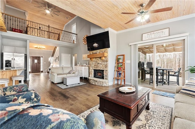 150 Crestview Rd, Jackson, GA 30233 - living room with wood ceiling, a ceiling fan, wood finished floors, crown molding, and a stone fireplace