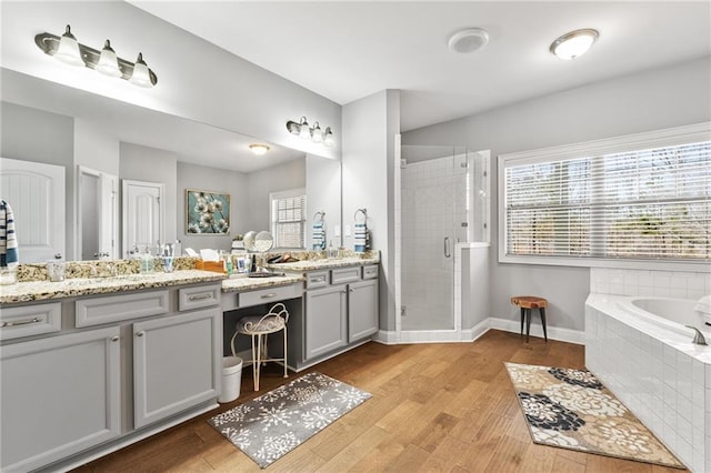 150 Crestview Rd, Jackson, GA 30233 - bathroom featuring a stall shower, wood finished floors, vanity, and a garden tub