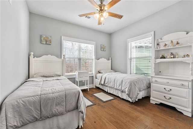 150 Crestview Rd, Jackson, GA 30233 - bedroom featuring multiple windows, dark wood-style flooring, and a ceiling fan