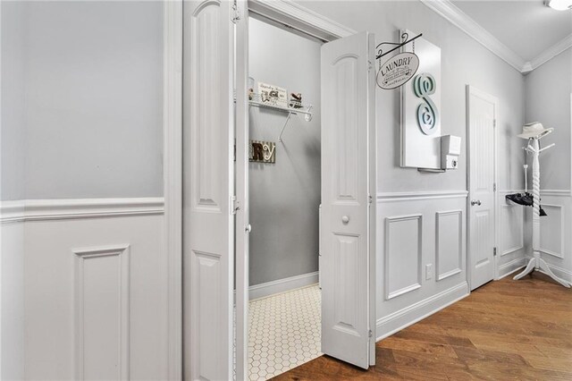 150 Crestview Rd, Jackson, GA 30233 - bathroom with crown molding, wood finished floors, a wainscoted wall, and a decorative wall