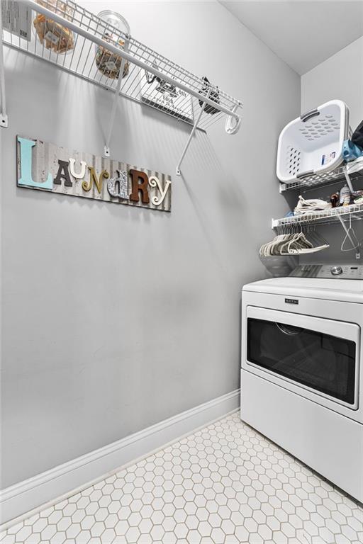150 Crestview Rd, Jackson, GA 30233 - clothes washing area with washer / clothes dryer, baseboards, and light flooring