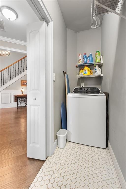 150 Crestview Rd, Jackson, GA 30233 - clothes washing area featuring washer / clothes dryer, ornamental molding, and baseboards