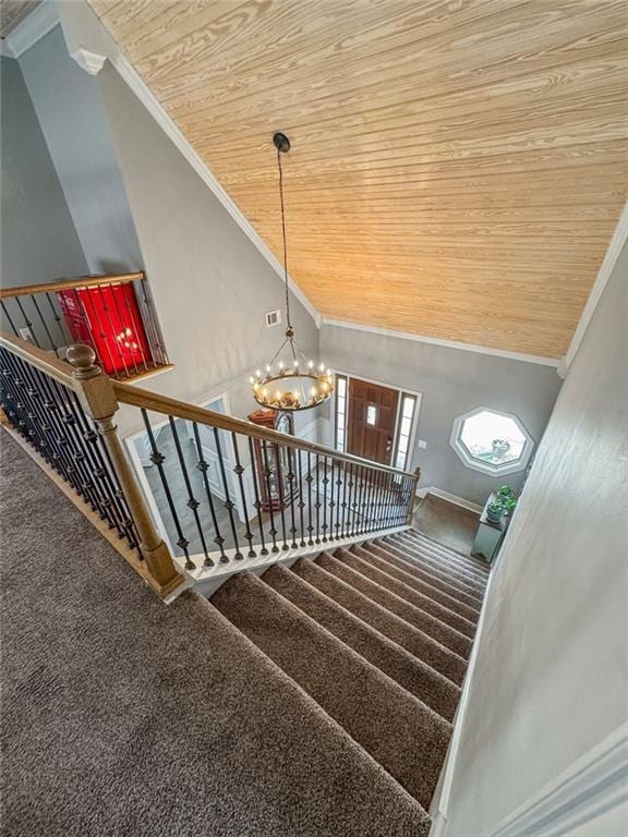 150 Crestview Rd, Jackson, GA 30233 - stairway with wood ceiling, crown molding, carpet floors, a chandelier, and lofted ceiling