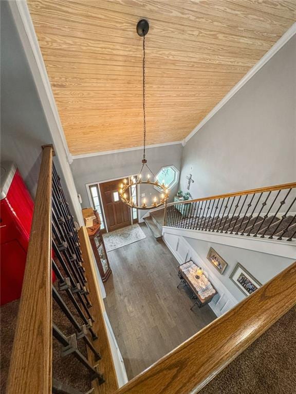 150 Crestview Rd, Jackson, GA 30233 - stairway with crown molding, a chandelier, wooden ceiling, and wood finished floors