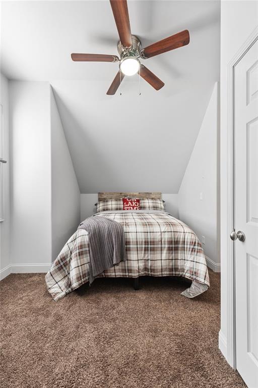 150 Crestview Rd, Jackson, GA 30233 - bedroom featuring carpet, lofted ceiling, ceiling fan, and baseboards