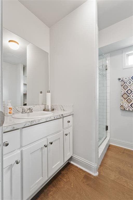 150 Crestview Rd, Jackson, GA 30233 - bathroom featuring baseboards, a shower stall, wood finished floors, and vanity