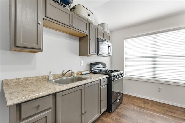 150 Crestview Rd, Jackson, GA 30233 - kitchen featuring stainless steel microwave, black gas stove, gray cabinets, a sink, and dark wood-style flooring