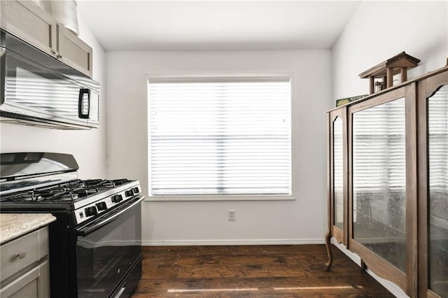 150 Crestview Rd, Jackson, GA 30233 - kitchen with black appliances, dark wood finished floors, gray cabinetry, baseboards, and healthy amount of natural light