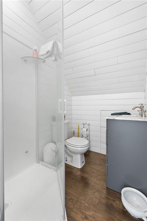 150 Crestview Rd, Jackson, GA 30233 - bathroom featuring vaulted ceiling, a shower stall, wood finished floors, and toilet