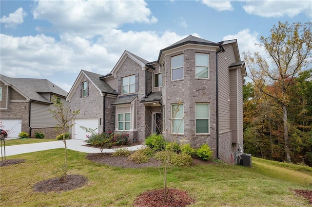 view of front of property with a front yard and a garage