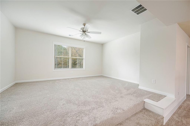 carpeted empty room with ceiling fan