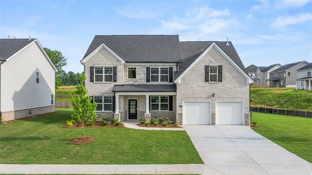 craftsman house with a garage, a front lawn, and covered porch