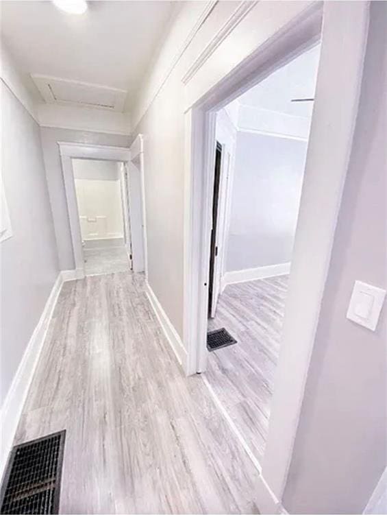 1127 Metropolitan Pkwy SW, Atlanta, GA 30310 - hallway with attic access, wood finished floors, and baseboards