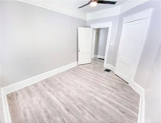 1127 Metropolitan Pkwy SW, Atlanta, GA 30310 - unfurnished bedroom featuring wood finished floors, baseboards, a ceiling fan, and a closet