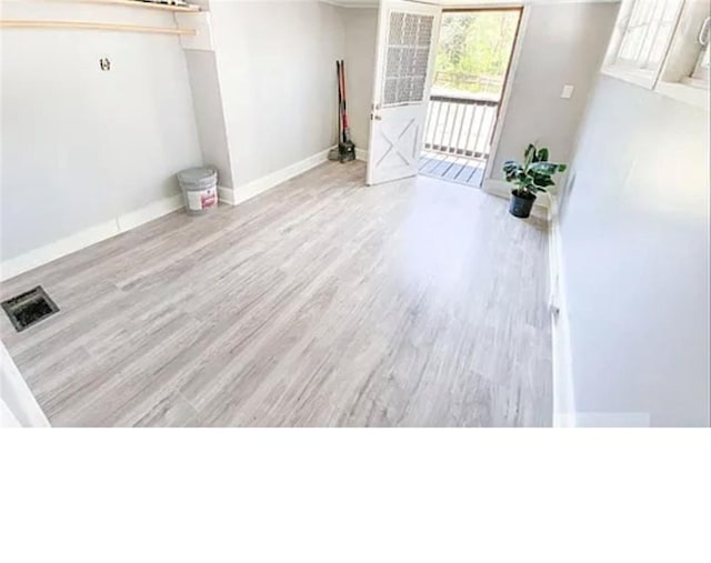1127 Metropolitan Pkwy SW, Atlanta, GA 30310 - unfurnished living room featuring wood finished floors and baseboards