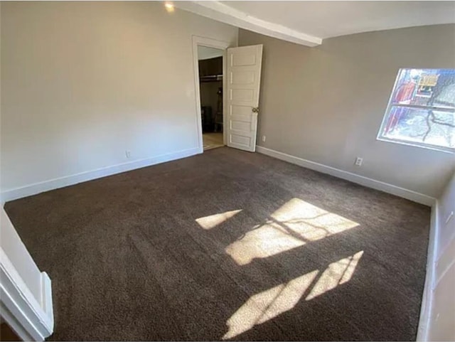 1127 Metropolitan Pkwy SW, Atlanta, GA 30310 - unfurnished bedroom with dark carpet, vaulted ceiling, and baseboards